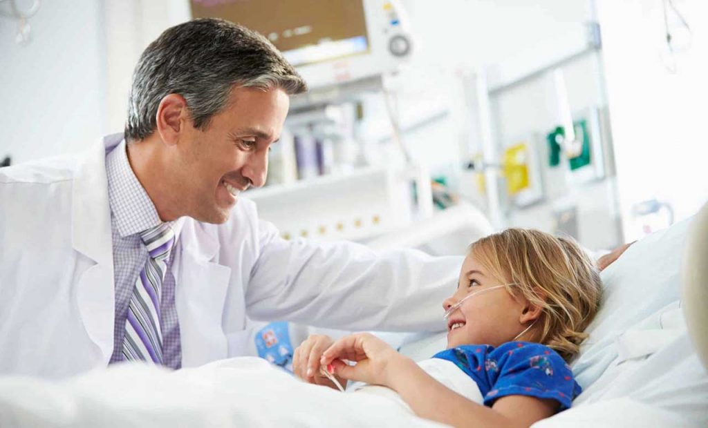 Image of Doctor Smiling to Patient Kid