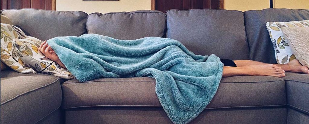 Image of People Sleeping in Couch